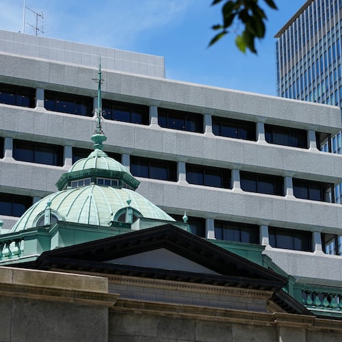 FILE - A Japanese flag flutters at the Bank of Japan headquarters in Tokyo, July 29, 2022. (AP Photo/Shuji Kajiyama, File)