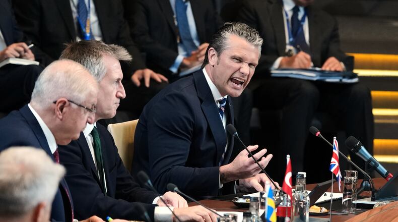 United States Defense Secretary Pete Hegseth, right, speaks during a meeting of the North Atlantic Council in defense ministers format at NATO headquarters in Brussels, Thursday, June 18, 2026. (AP Photo/Virginia Mayo)