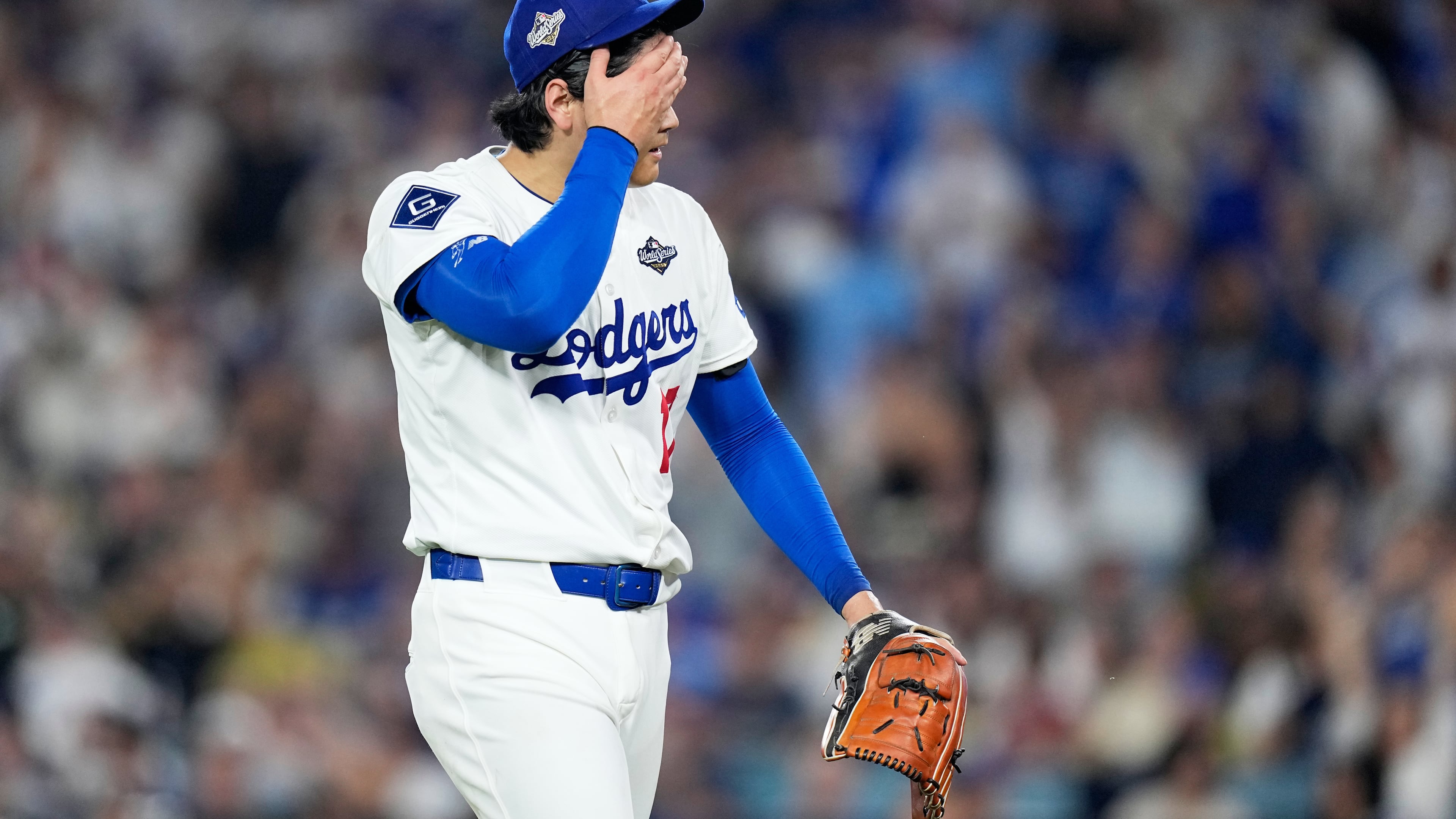 Los Angeles Dodgers pitcher Shohei Ohtani walks to the dugout after striking out Toronto Blue Jays' Alejandro Kirk during the sixth inning in Game 4 of baseball's World Series, Tuesday, Oct. 28, 2025, in Los Angeles. (AP Photo/Brynn Anderson)