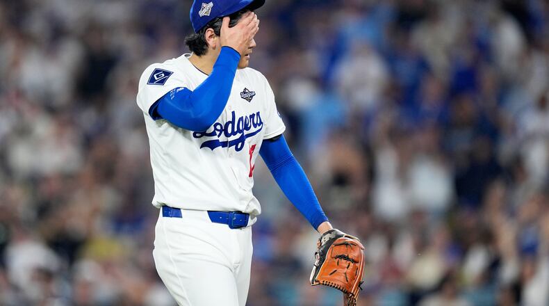 Los Angeles Dodgers pitcher Shohei Ohtani walks to the dugout after striking out Toronto Blue Jays' Alejandro Kirk during the sixth inning in Game 4 of baseball's World Series, Tuesday, Oct. 28, 2025, in Los Angeles. (AP Photo/Brynn Anderson)