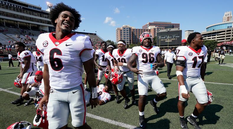 Georgia players leave the field after a win over Vanderbilt in an NCAA college football game Saturday, Sept. 25, 2021, in Nashville, Tenn. Georgia won 62-0. (AP Photo/Mark Humphrey)