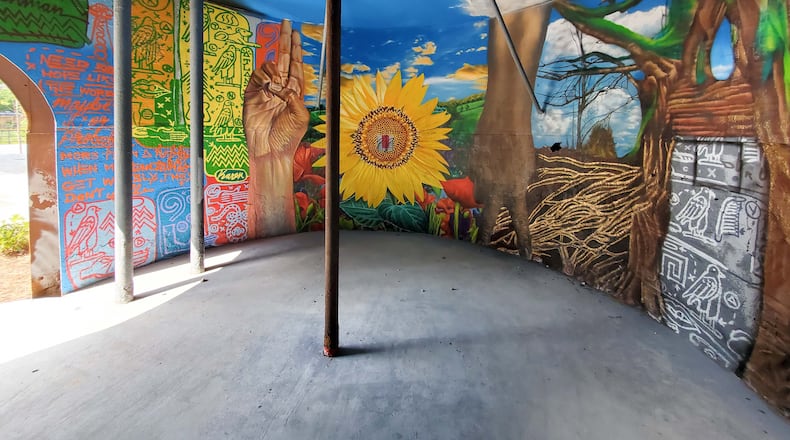 Fabian Williams and Karen Anderson Singer (of Tiny Doors Atlanta) created this in-the-round mural in an old building that developers saved when clearing land for the Penman Apartments in Grant Park. Courtesy of Arthur Rudick