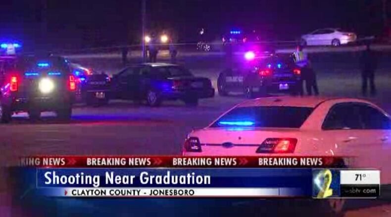 A shooting near a high school graduation killed one woman and injured another, police said.