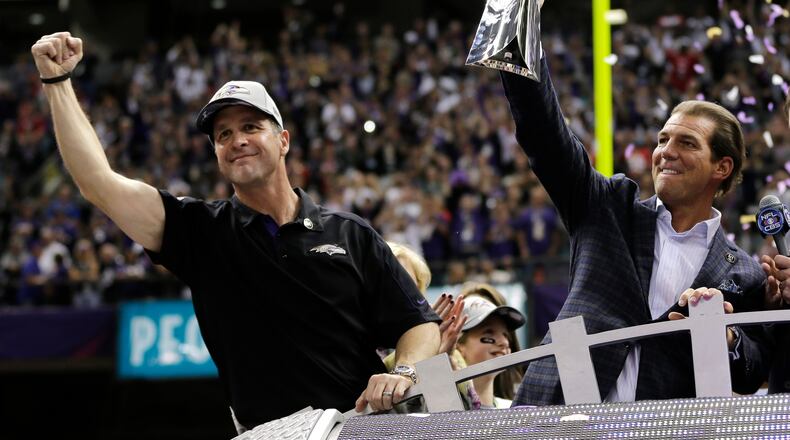 John Harbaugh (left) — pictured celebrating the Ravens' 2013 Super Bowl victory with team owner Stephen J. Bisciotti — took the Giants' head coaching job in large part because he reports directly to team owner John Mara as opposed to having a general manager or other executive to report to. (Matt Slocum/AP 2013)