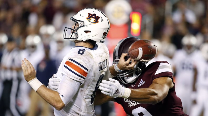 FILE - In this Oct. 6, 2018, file photo, Mississippi State defensive end Montez Sweat (9) forces Auburn quarterback Jarrett Stidham (8) to fumble as he attempts to pass during the second half of an NCAA college football game, in Starkville, Miss. A main reason Mississippi State is allowing fewer than 13 points per game is a defensive front anchored by end Montez Sweat and tackle Jeffery Simmons. Sweat has 18 sacks in 19 career games. Mississippi State plays at LSU on Saturday, Oct. 20. (AP Photo/Rogelio V. Solis)