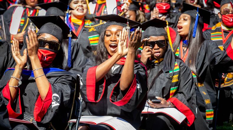 Members of the Clark Atlanta University 2020 graduating class celebrate during the Saturday ceremony at the Harkness Hall Quadrangle in Atlanta May 15, 2021. The 2020 ceremony was postponed because of the COVID-19 pandemic. (Photo: Steve Schaefer for The Atlanta Journal-Constitution)