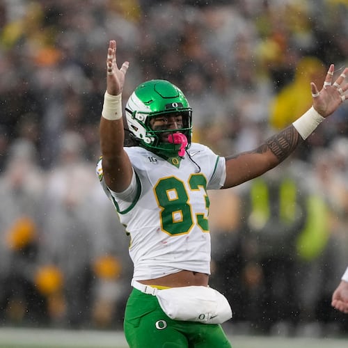 Oregon tight end Roger Saleapaga (83) celebrates a field goal during the first half of an NCAA college football game against Iowa, Saturday, Nov. 8, 2025, in Iowa City, Iowa. (AP Photo/Charlie Neibergall)