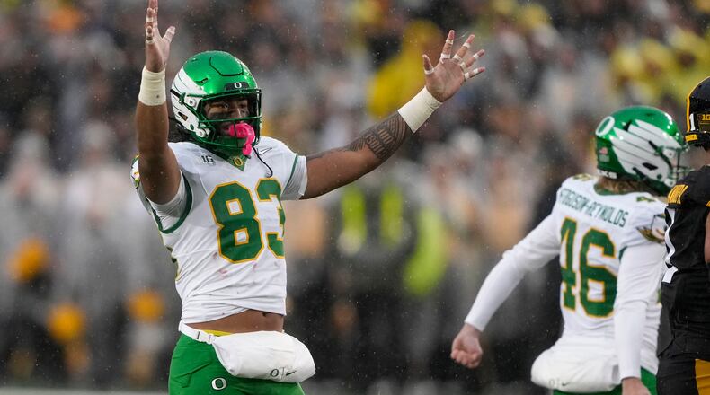 Oregon tight end Roger Saleapaga (83) celebrates a field goal during the first half of an NCAA college football game against Iowa, Saturday, Nov. 8, 2025, in Iowa City, Iowa. (AP Photo/Charlie Neibergall)