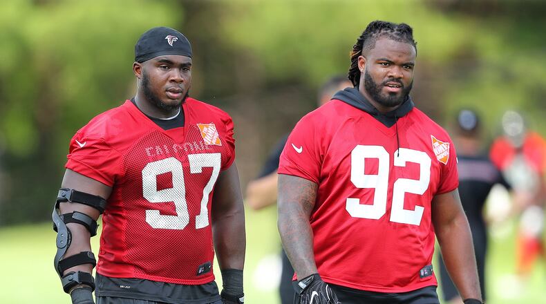 June 13, 2017, Flowery Branch: Atlanta Falcons defensive tackles Dontari Poe (right) and Grady Jarrett walk off the field at the conclusion of the first day of mini-camp on Tuesday, June 13, 2017, in Flowery Branch. Curtis Compton/ccompton@ajc.com