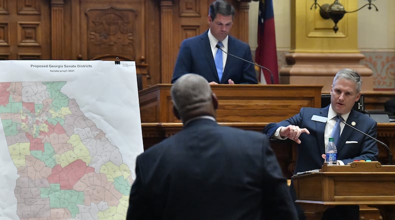 November 9, 2021 Atlanta - Sen. John Kennedy (R-18, Macon) answers a question from Emanuel Jones (D-10, Decatur), foreground, in the Senate Chambers during a special session at the Georgia State Capitol in Atlanta on Tuesday, November 9, 2021. The hearing was a step toward votes on new political maps for the state House, state Senate and Congress during a once-a-decade redistricting session of the General Assembly. The Senate plans to vote on new maps Tuesday, and the House Redistricting Committee could advance its proposal as well. (Hyosub Shin / Hyosub.Shin@ajc.com)
