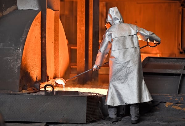 FILE - A handles molten metal at the Thyssenkrupp steel factory in Duisburg, Germany, April 27, 2018. (AP Photo/Martin Meissner, File)