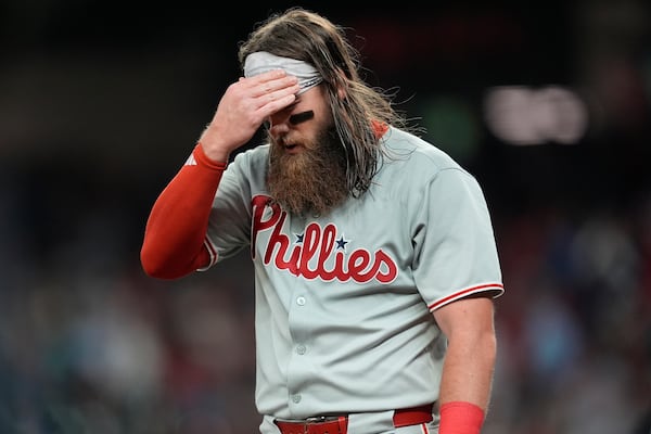 Philadelphia Phillies outfielder Brandon Marsh reacts to play against the Atlanta Braves in the fourth inning of a baseball game, Wednesday, April 9, 2025, in Atlanta. (AP Photo/Mike Stewart)