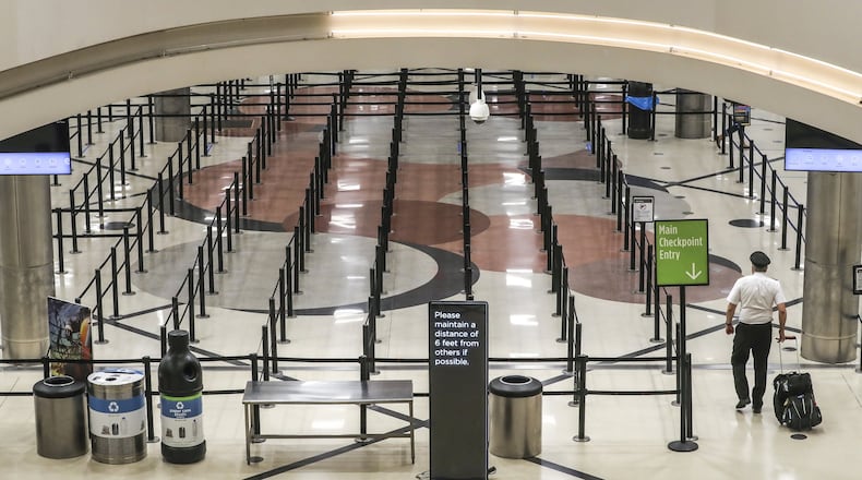 A nearly empty Hartsfield-Jackson International Airport on Thursday April 9, 2020. JOHN SPINK/JSPINK@AJC.COM
