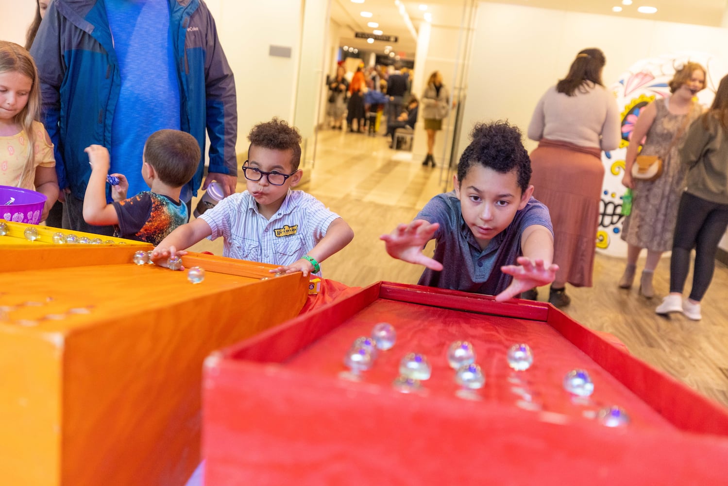 A boy plays a game at the Dia de Los Muertos Festival hosted by the Atlanta Symphony Orchestra at the Woodruff Arts Center on Sunday, October 30, 2022. (Photo: Jenn Finch for The Atlanta Journal-Constitution)


