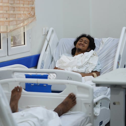 Indonesian crew member Muhammad Al Taindo , right, receives medical treatment at 2 December Hospital in Mokha, Yemen, Wednesday, Aug. 12, 2026, after the cargo ship Tihama was struck in a Houthi attack in the Bab al-Mandab Strait off Yemen's Dhubab district on Aug. 10, 2026. (AP Photo/Abdulnasser Alseddik)