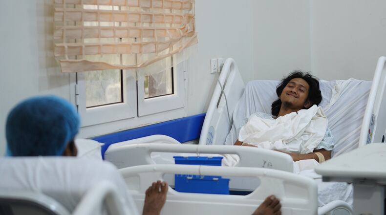 Indonesian crew member Muhammad Al Taindo , right, receives medical treatment at 2 December Hospital in Mokha, Yemen, Wednesday, Aug. 12, 2026, after the cargo ship Tihama was struck in a Houthi attack in the Bab al-Mandab Strait off Yemen's Dhubab district on Aug. 10, 2026. (AP Photo/Abdulnasser Alseddik)