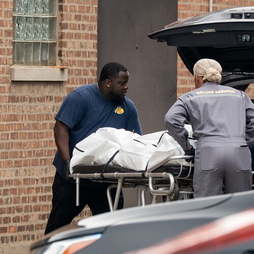 Workers load bodies into an SUV outside South Chicago Chapel on Friday, Aug. 7, 2026, after authorities found more than 50 bodies improperly stored at the funeral home during an investigation the previous night in Chicago. (Pat Nabong /Chicago Sun-Times via AP)