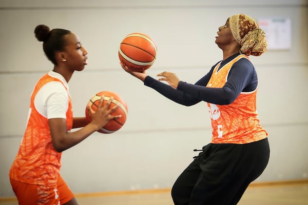 A player wearing a headscarf warms-up before a basketball game, in Aubervilliers near Paris, Sunday, April 27, 2025. (AP Photo/Thomas Padilla)