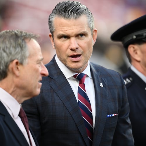 Defense Secretary Pete Hegseth is seen on the sidelines before an NFL football game between the Washington Commanders and the Detroit Lions Sunday, Nov. 9, 2025, in Landover, Md. (AP Photo/Nick Wass)