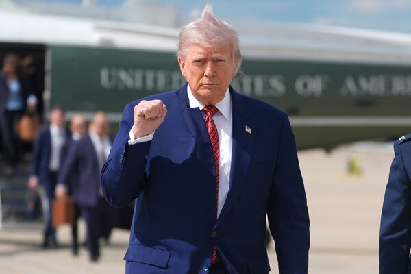 President Donald Trump gestures as he walks to board Air Force One to depart Joint Base Andrews, Md., Friday, May 23, 2025. (AP Photo/Manuel Balce Ceneta)