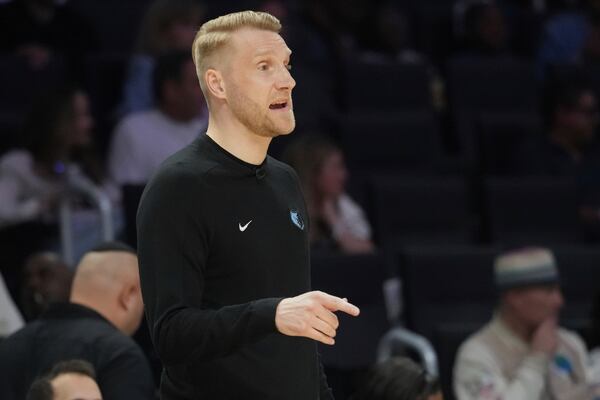 Memphis Grizzlies interim head coach Tuomas Lisalo gestures during the first half of an NBA basketball game against the Miami Heat, Thursday, April 3, 2025, in Miami. (AP Photo/Marta Lavandier)