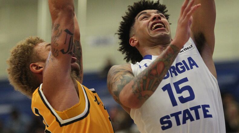 January 23, 2017, Atlanta, Georgia - GSU guard D/Marcus Simonds (15) leaps away from ASU guard Emarius Logan (11) to score a basket in a Sun Belt Conference college basketball game between Georgia State University and Appalachian State University in Atlanta, Georgia, on Monday, January 23, 2017. (HENRY TAYLOR / HENRY.TAYLOR@AJC.COM)