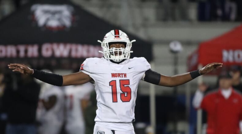 North Gwinnett defensive end Jared Ivey (15) celebrates a defensive stop in the second half against McEachern in the Class 7A quarterfinals at McEachern High School Friday, November 29, 2019 in Powder Springs, Ga. North Gwinnett won 32-13. (JASON GETZ/SPECIAL TO THE AJC)