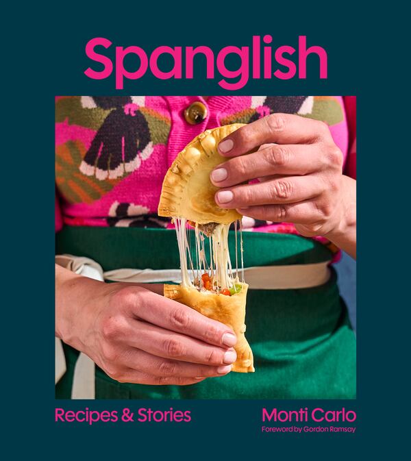 The cover of the Spanglish cookbook shows a photo of the author pulling apart a savory pastry.