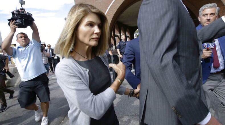 FILE PHOTO: Lori Loughlin, her fashion designer husband, Mossimo Giannulli, and nine other parents face new charges in the college admissions scandal.