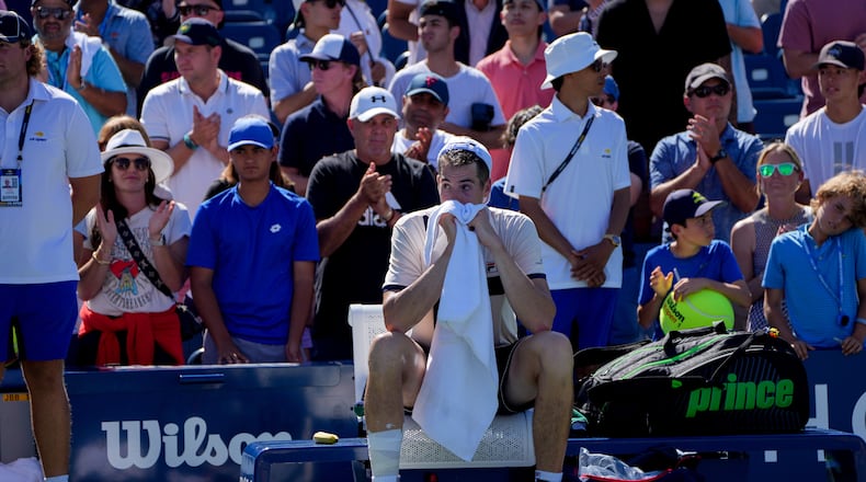 John Isner, of the United States, reacts after losing to Michael Mmoh, of the United States, on the second day of the 2023 U.S. Open tennis tournament in New York, on Thursday, Aug. 31, 2023. (Amir Hamja/The New York Times)