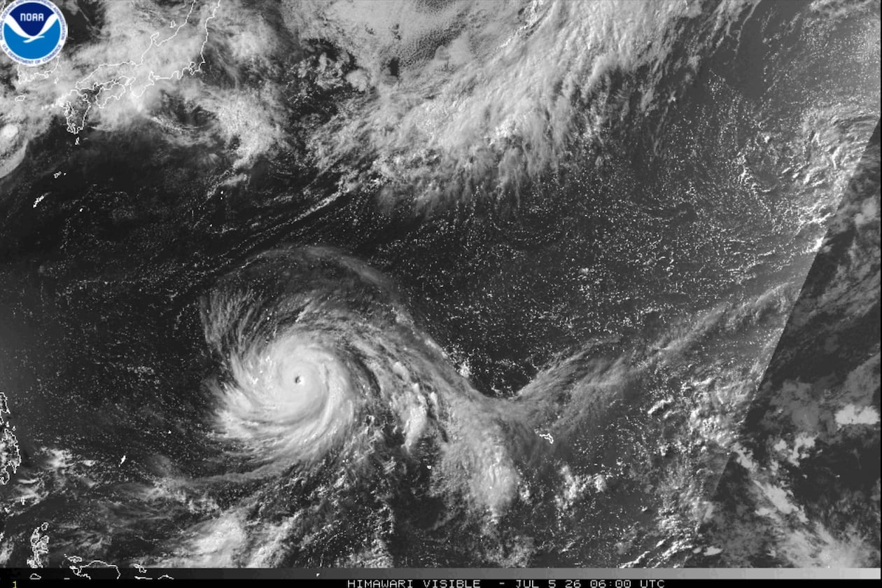 This satellite image from the National Oceanic and Atmospheric Administration shows Typhoon Bavi nearing the U.S. Pacific island territory of Guam on Sunday, July 5, 2026. (NOAA via AP)