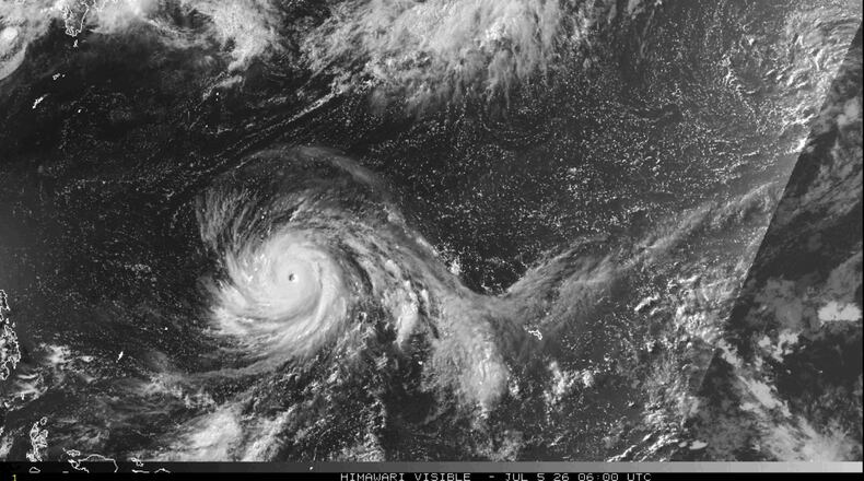 This satellite image from the National Oceanic and Atmospheric Administration shows Typhoon Bavi nearing the U.S. Pacific island territory of Guam on Sunday, July 5, 2026. (NOAA via AP)