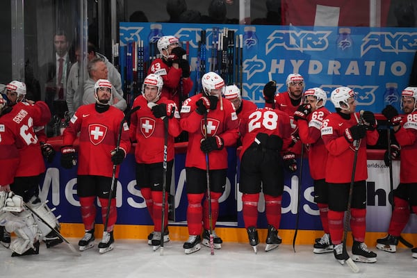 Swiss players stand dejected after the final match between United States and Switzerland at the ice hockey world championships in Stockholm, Sweden, Sunday, May 25, 2025. (AP Photo/Petr David Josek)