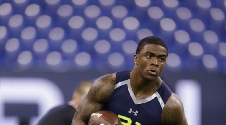 Georgia Southern running back Jerick Mckinnon, who went to Sprayberry High, runs a drill at the NFL football scouting combine in Indianapolis, Sunday, Feb. 23, 2014. (AP Photo/Michael Conroy)