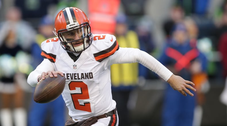 Cleveland Browns quarterback Johnny Manziel looks to pass against the Seattle Seahawks in the second half of an NFL football game, Sunday, Dec. 20, 2015, in Seattle. (AP Photo/Scott Eklund)