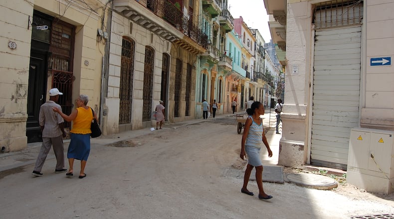 A woman walks in Old Havana on Sunday, June 28, 2015. (KATIE LESLIE / KLESLIE@AJC.COM)