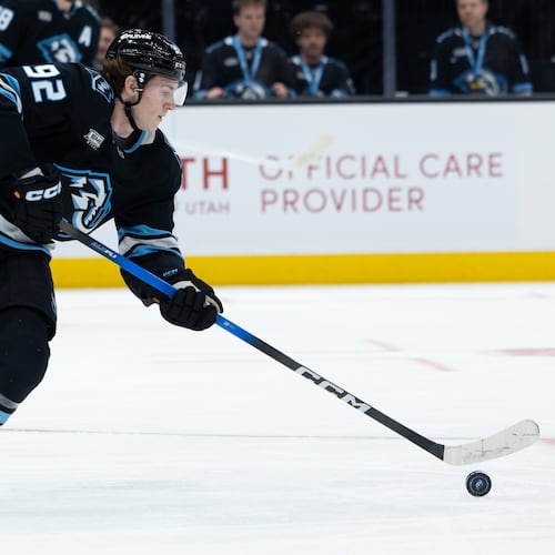 Utah Mammoth center Logan Cooley takes control of the puck during the first period of an NHL hockey game against the Vegas Golden Knights, Monday, Nov. 24, 2025, in Salt Lake City. (AP Photo/Anna Fuder)