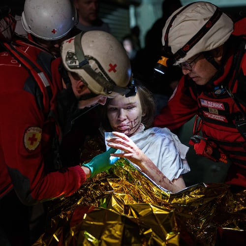 Red Cross volunteers help an injured woman in a shelter after a Russian strike on a residential neighborhood in Kyiv, Ukraine, on Sunday, May 24, 2026. (AP Photo/Evgeniy Maloletka)
