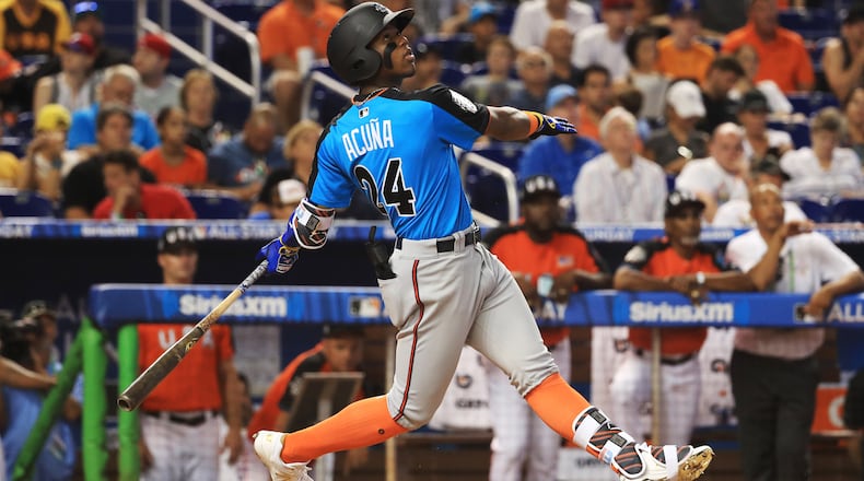 MIAMI, FL - JULY 09:  Ronald Acuna #24 of the Atlanta Braves and the World Team swings at a pitch against the U.S. Team during the SiriusXM All-Star Futures Game at Marlins Park on July 9, 2017 in Miami, Florida.  (Photo by Mike Ehrmann/Getty Images)