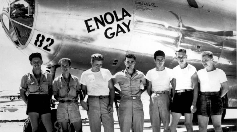 The U.S. ground crew of the Enola Gay, led by pilot Paul W. Tibbets (center), made history by dropping an atomic bomb on the Japanese city of Hiroshima on Aug. 6, 1945.