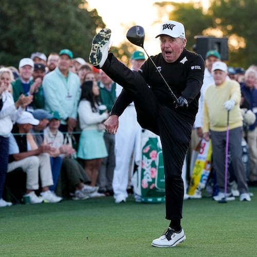 Gary Player kicks his leg in the air after hitting the ceremonial tee shot on the first hole during the first round of the Masters golf tournament at the Augusta National Golf Club, Thursday, April 9, 2026, in Augusta, Ga. (AP Photo/David J. Phillip)