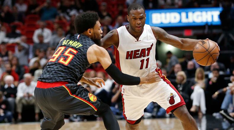 Miami Heat guard Dion Waiters (11) is defended by Atlanta Hawks forward DeAndre Bembry (95) during the first half of an NBA basketball game, Wednesday, Feb. 1, 2017, in Miami. (AP Photo/Wilfredo Lee)