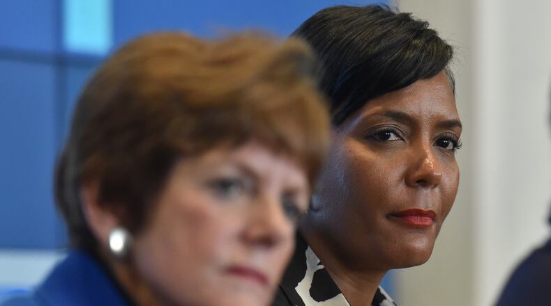 December 1, 2017 Atlanta - Atlanta mayoral candidates Mary Norwood (left) and Keisha Lance Bottoms discuss during an event to discuss on the topic of education at the Gathering Spot in Atlanta on Friday, December 1, 2017. HYOSUB SHIN / HSHIN@AJC.COM