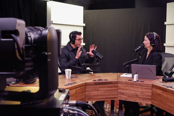 Rivian CEO RJ Scaringe (left) chatted with Politically Georgia podcast host Patricia Murphy at the AJC studio in Atlanta on Monday. (Natrice Miller/AJC)