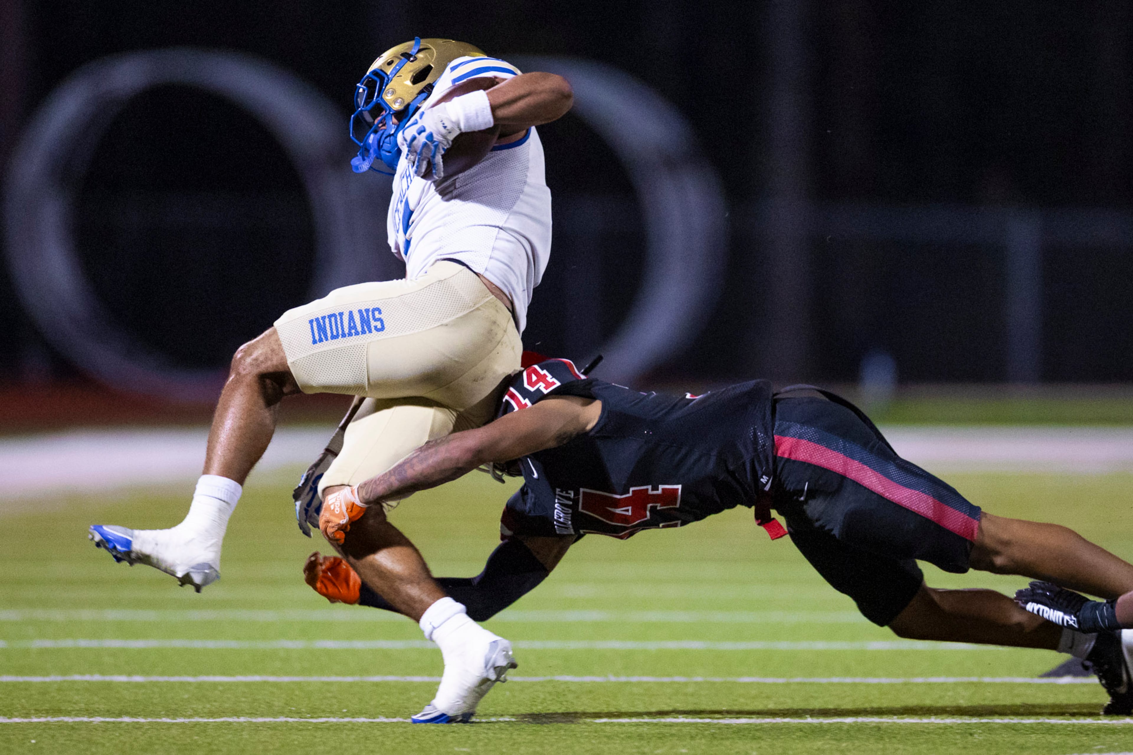 Hillgrove defensive back Jayden Wright (0) tackles McEachern running back Henry Pullen (4) at Cobb Energy Hillgrove Stadium in Powder Springs, GA on Friday, October 17th, 2025. (Oscar Guevara Saenz for the AJC)