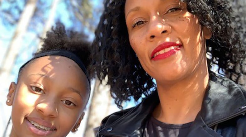 Meredith Littles of College Park says she was forced to change her travel plans with her daughter, Kaelyn, because she couldn't get her a passport.