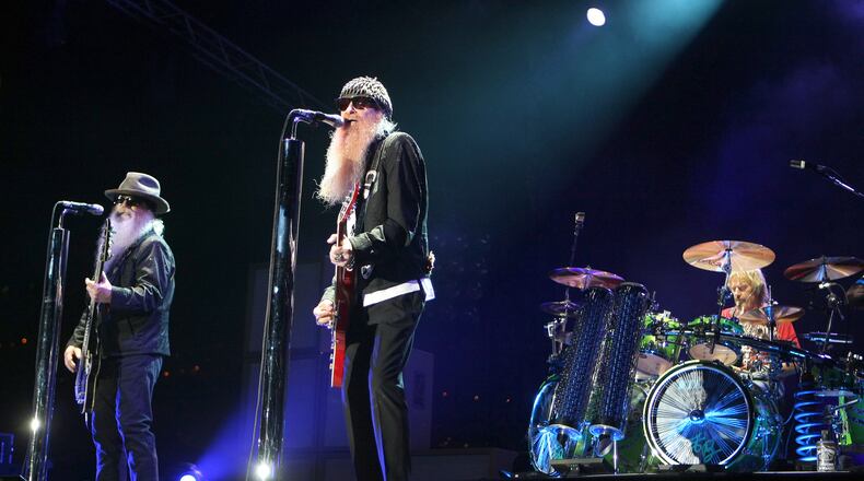 FILE - Billy Gibbons, from left, Dusty Hill and Frank Beard of ZZ Top, perform in Monaco on July 5, 2010. (AP Photo/Lionel Cironneau, File)