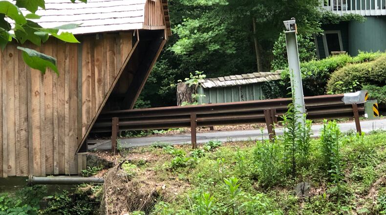 Cobb County is installing mast arms that will have chains and plastic-covered PVC pipes suspended at a seven-foot height, the same clearance for the Concord Road covered bridge.