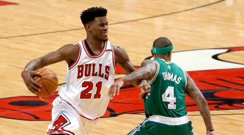Chicago Bulls' Jimmy Butler (21) is fouled by Boston Celtics' Isaiah Thomas during the second half in Game 4 of an NBA basketball first-round playoff series in Chicago, Sunday, April 23, 2017. The Celtics won 104-95. (AP Photo/Charles Rex Arbogast)