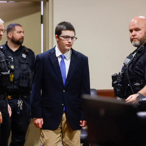 Colt Gray, the 16-year-old Apalachee High School shooting suspect, is led in by deputies for a plea hearing at Barrow County Superior Court in Winder, Ga., on Friday, July 24, 2026. (Arvin Temkar/Atlanta Journal-Constitution via AP)
